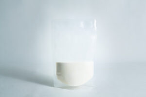 A clear resealable pouch, filled halfway with Agar Mix MYAG Antibacterial Malt Extract Yeast white powder, set against a plain white background.