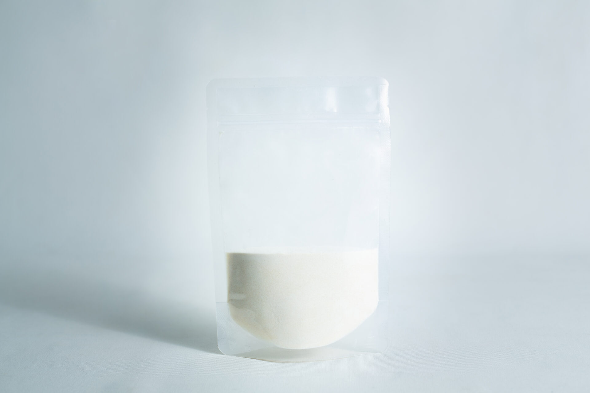 A clear resealable pouch, filled halfway with Agar Mix MYAG Antibacterial Malt Extract Yeast white powder, set against a plain white background.