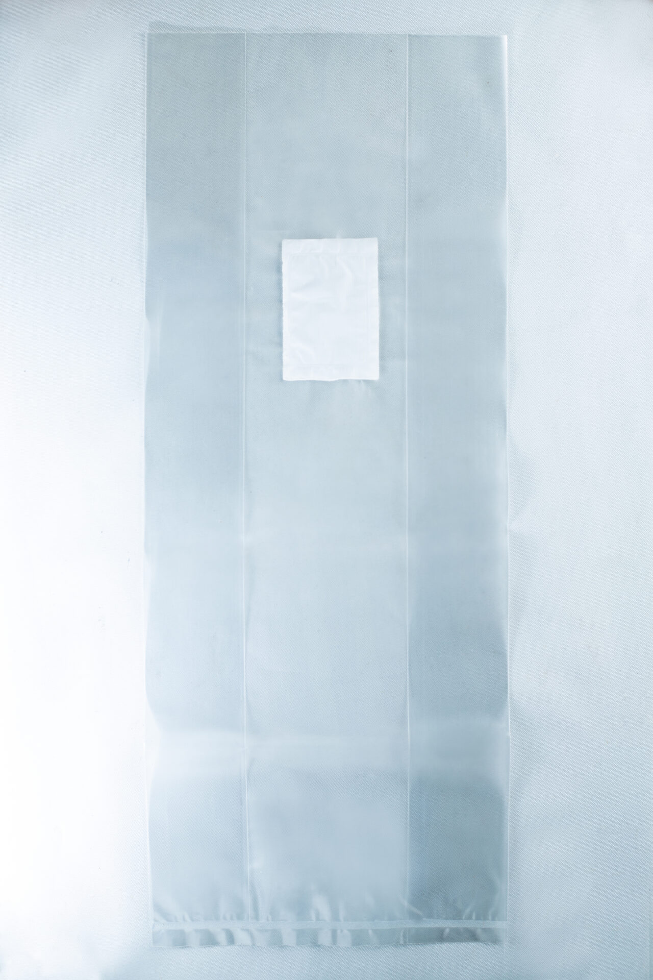 The Mushroom Grow Bags Unicorn for spawn and substrate feature translucent plastic with a white rectangular patch in the centre, perfect for cultivating mushrooms, and are shown on a light background.
