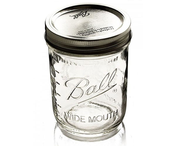 The Ball mason pint jars wide mouth set of 6 features clear, durable, autoclavable glass with metal lids and embossed fronts. Perfect for preserving or storage.