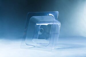 The Mycelium Mould Growth Form - Plant Pot Heavy Duty (Reusable) is displayed on a flat surface with a blue gradient background, its clear plastic design inspired by natural mycelium mould growth patterns.