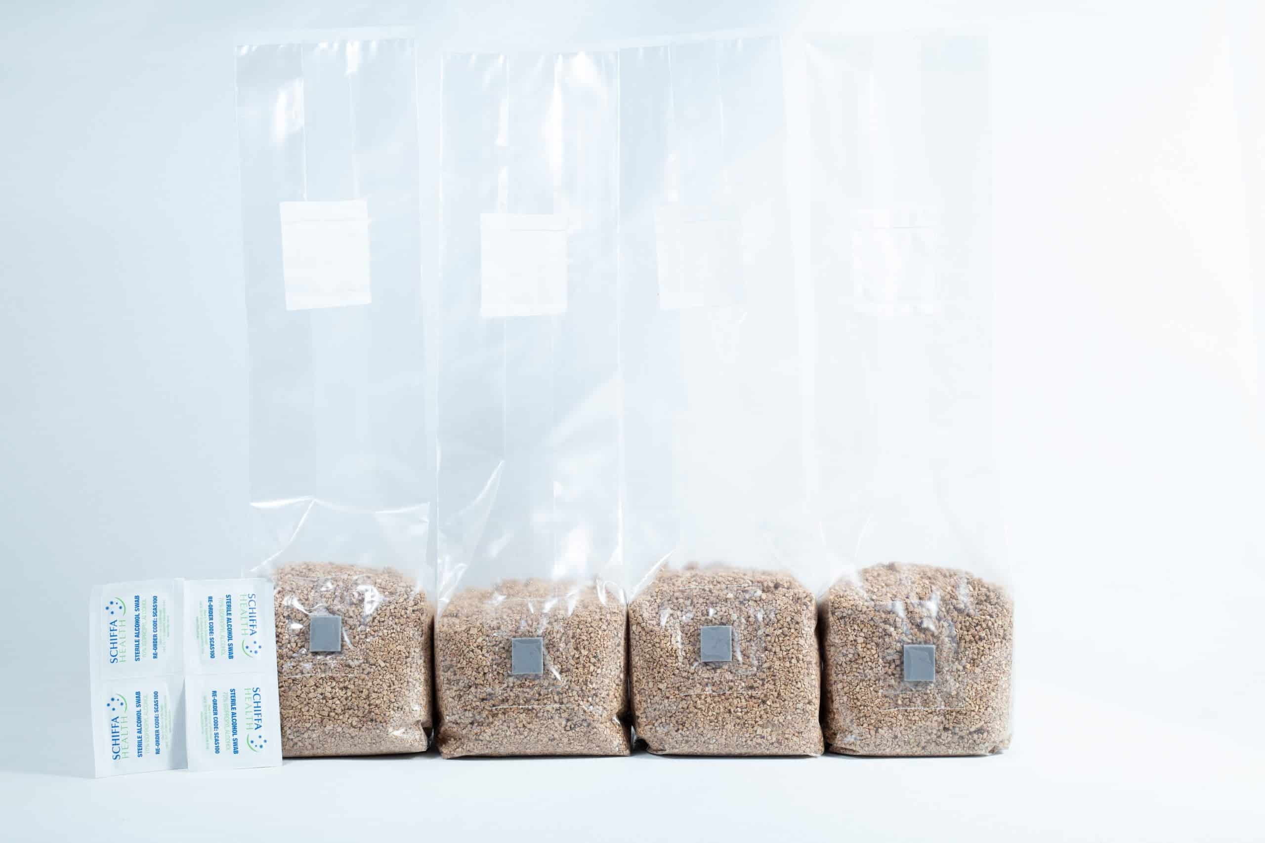 Three 1kg Organic Brown Rice Flour (BRF) & Vermiculite bags for PF Tek cultivation are arranged in a row on a white background—ideal for easy mushroom growing.