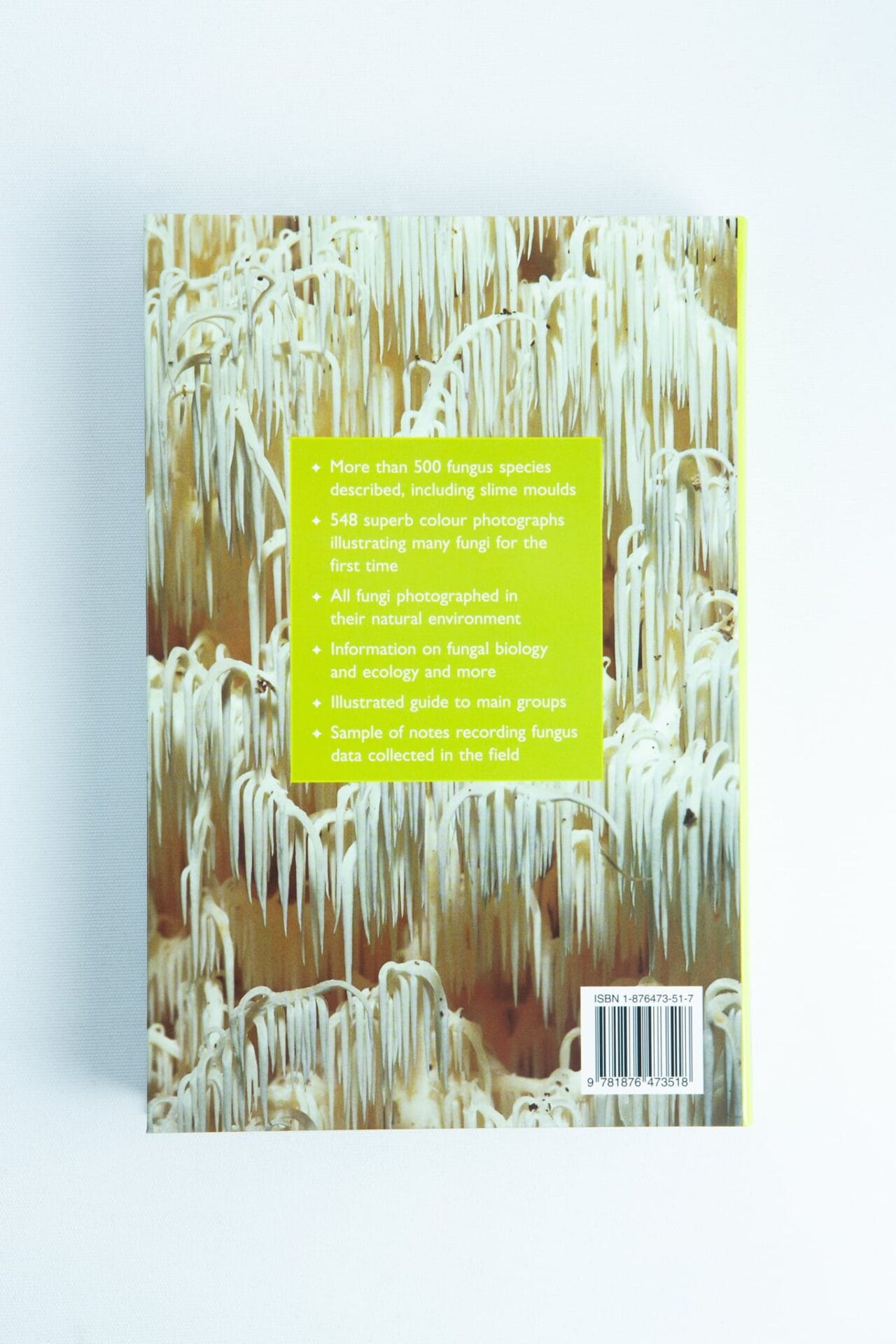 Back cover of "A Field Guide to Australian Fungi Book by Bruce Fuhrer," featuring a photo of white fungi and a green box with yellow text highlighting key features—a must-have for mycology enthusiasts and those seeking an Australian fungi field guide.