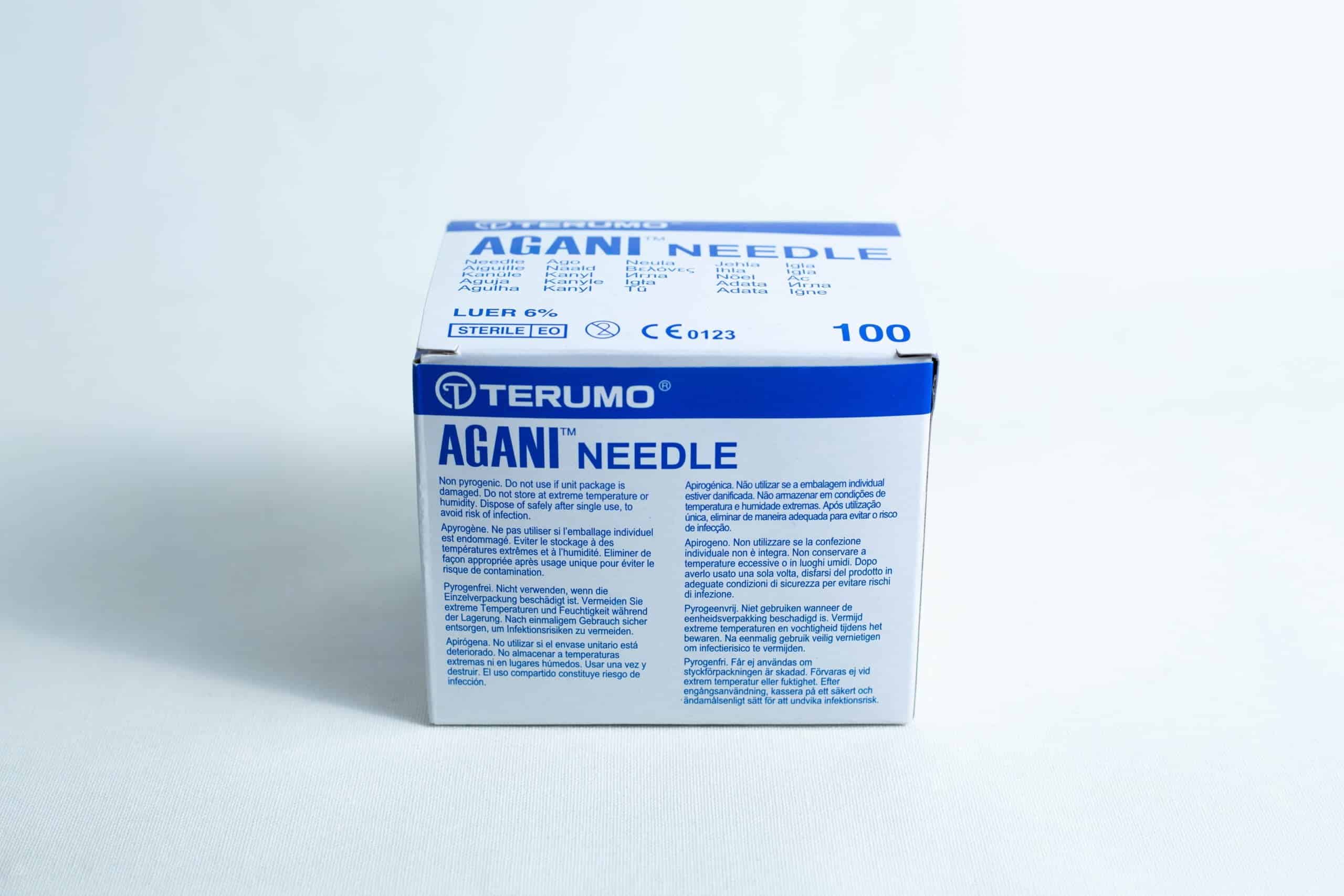 A box of sterile 18G hypodermic needles, whole box of 100pcs, featuring product details and blue text on a white background.