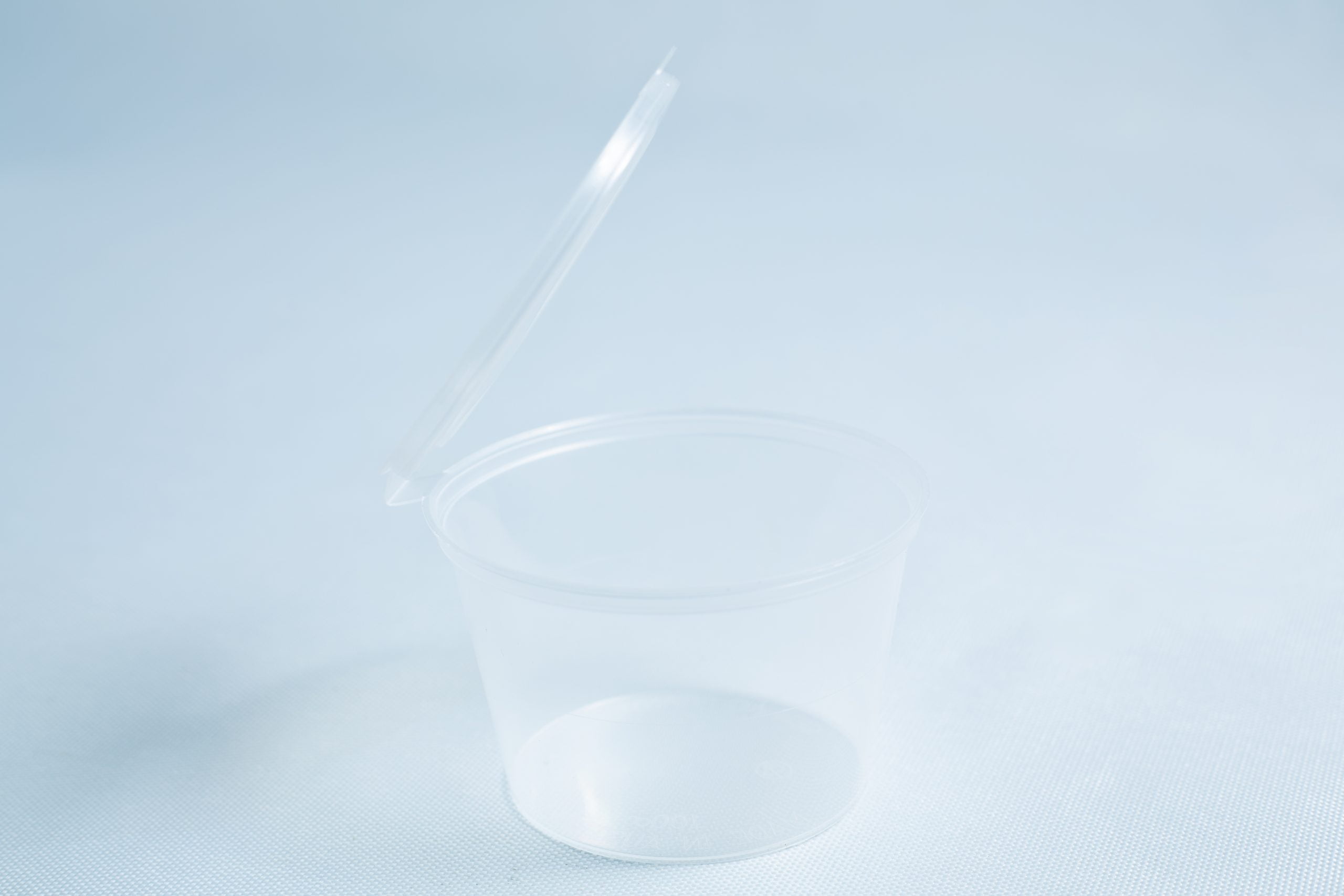 Agar Container - Alternative to Petri Dish (50 x 100ml) with an open hinged lid, displayed on a light blue surface.