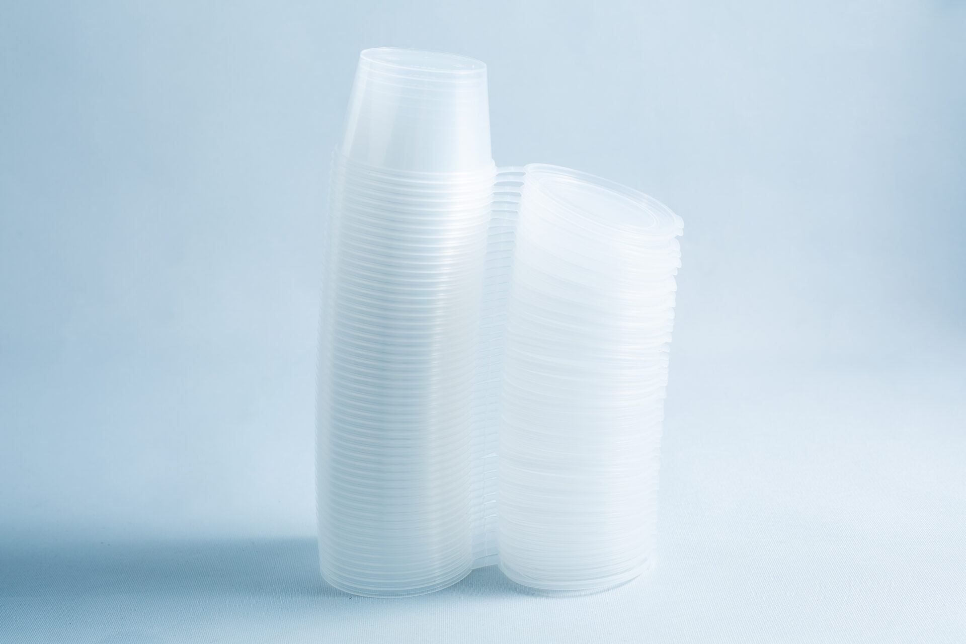 Stacks of clear, disposable Agar Containers—an alternative to Petri dishes—arranged on a light, plain background. Each holds 100ml; set includes 50 containers.