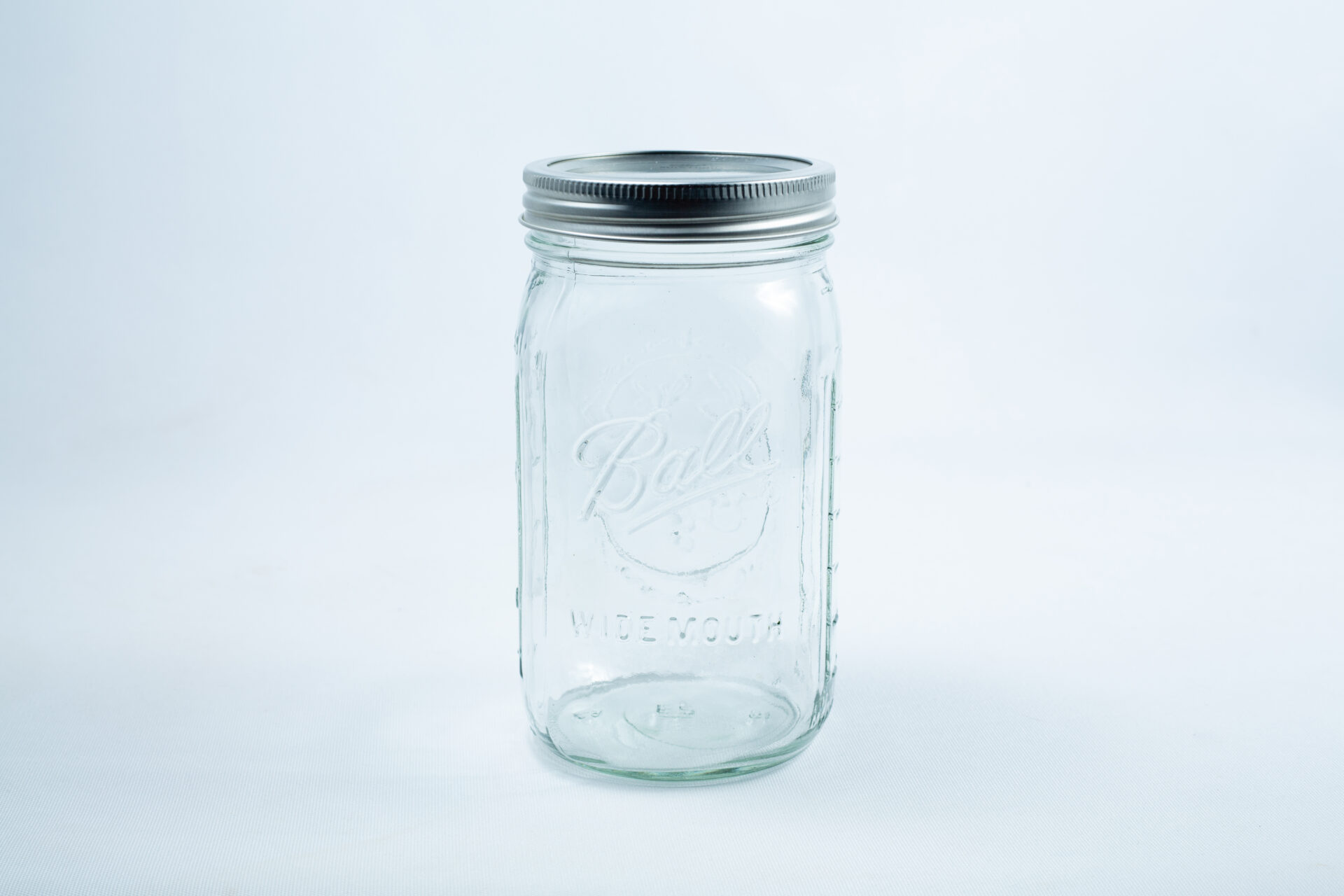 Clear 1 Litre Ball mason jar with metal lid, shown on a white background—ideal for safe, versatile storage; part of a 12-pack set for preserving and autoclavable use.