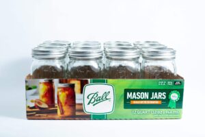 Ball Mason jars 1 litre 12x for canning autoclavable, come in a green and white box with metal lids. Ideal for preserving, canning, or storage.