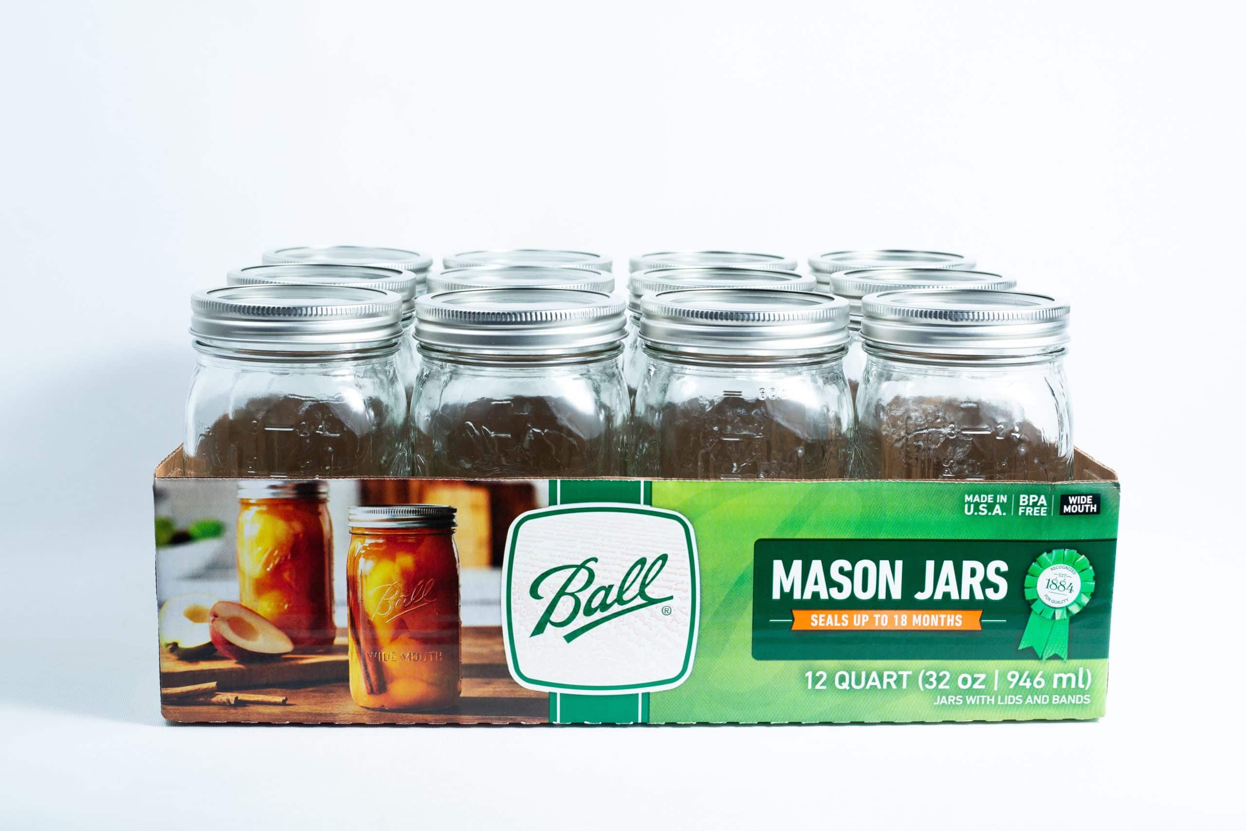 Ball Mason jars 1 litre 12x for canning autoclavable, come in a green and white box with metal lids. Ideal for preserving, canning, or storage.