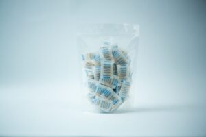 A clear plastic bag containing Desiccant Silica Gel 5g | Reusable, with each packet individually wrapped, displayed on a white background.
