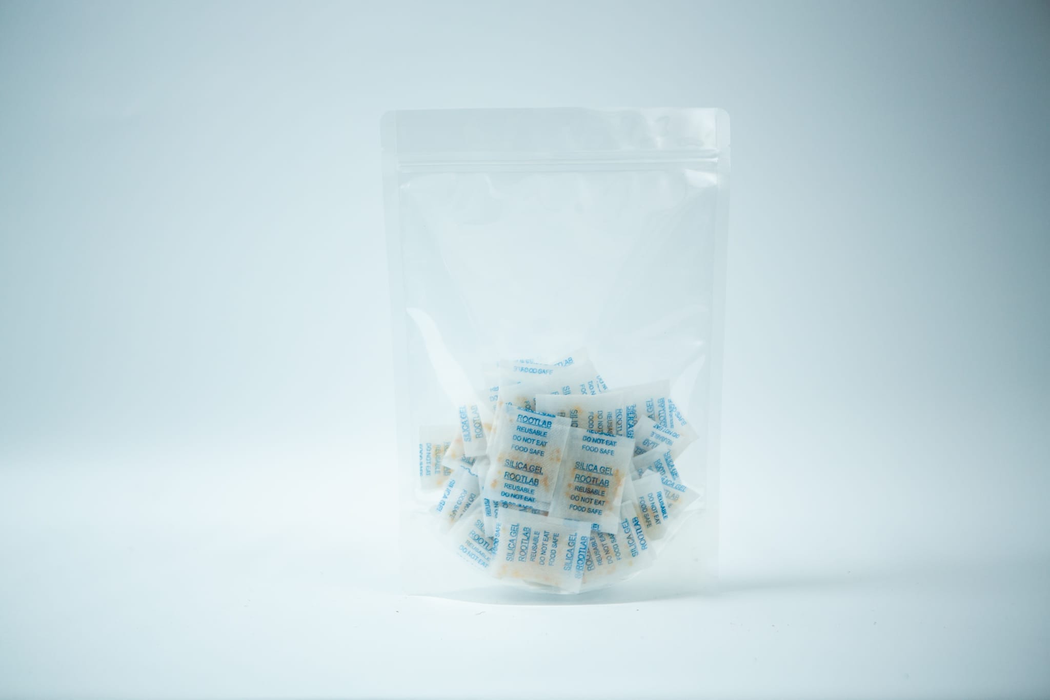 A clear resealable bag containing Desiccant Silica Gel 5g | Reusable sachets, shown against a plain white background.