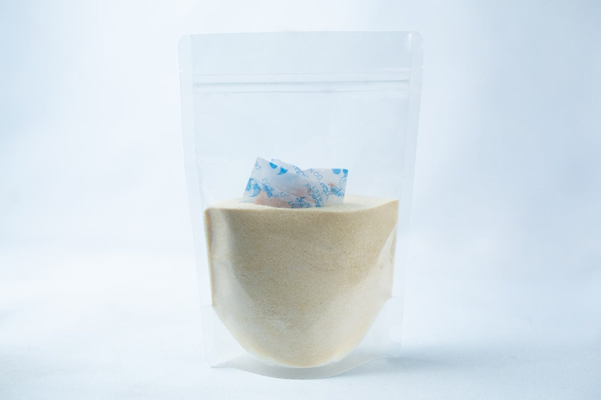 Liquid Culture Pre-mix | DLME | Now Extra Clear: Clear plastic pouch containing Dextrose and Light Malt Extract powder blend, with a small silica gel sachet inside, displayed on a white background.