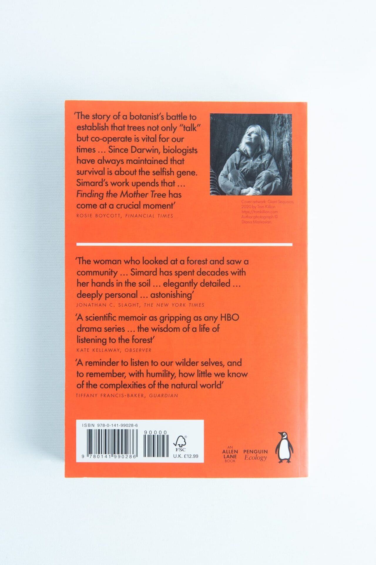 Back cover of Finding the Mother Tree by Suzanne Simard features reviews, a barcode, and a small black-and-white author photo on an orange background—ideal for fans of mushroom books.