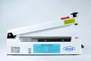 A white Heat Sealer 30cm with 5mm seal width, cutter, magnet, lever handle, and an instruction label on the side.