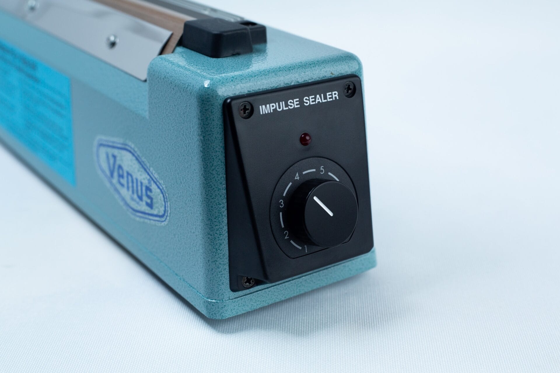 A close-up of the Heat Sealer 30cm Seal Width 5mm with cutter showcases the precision and durability of this essential machine.
