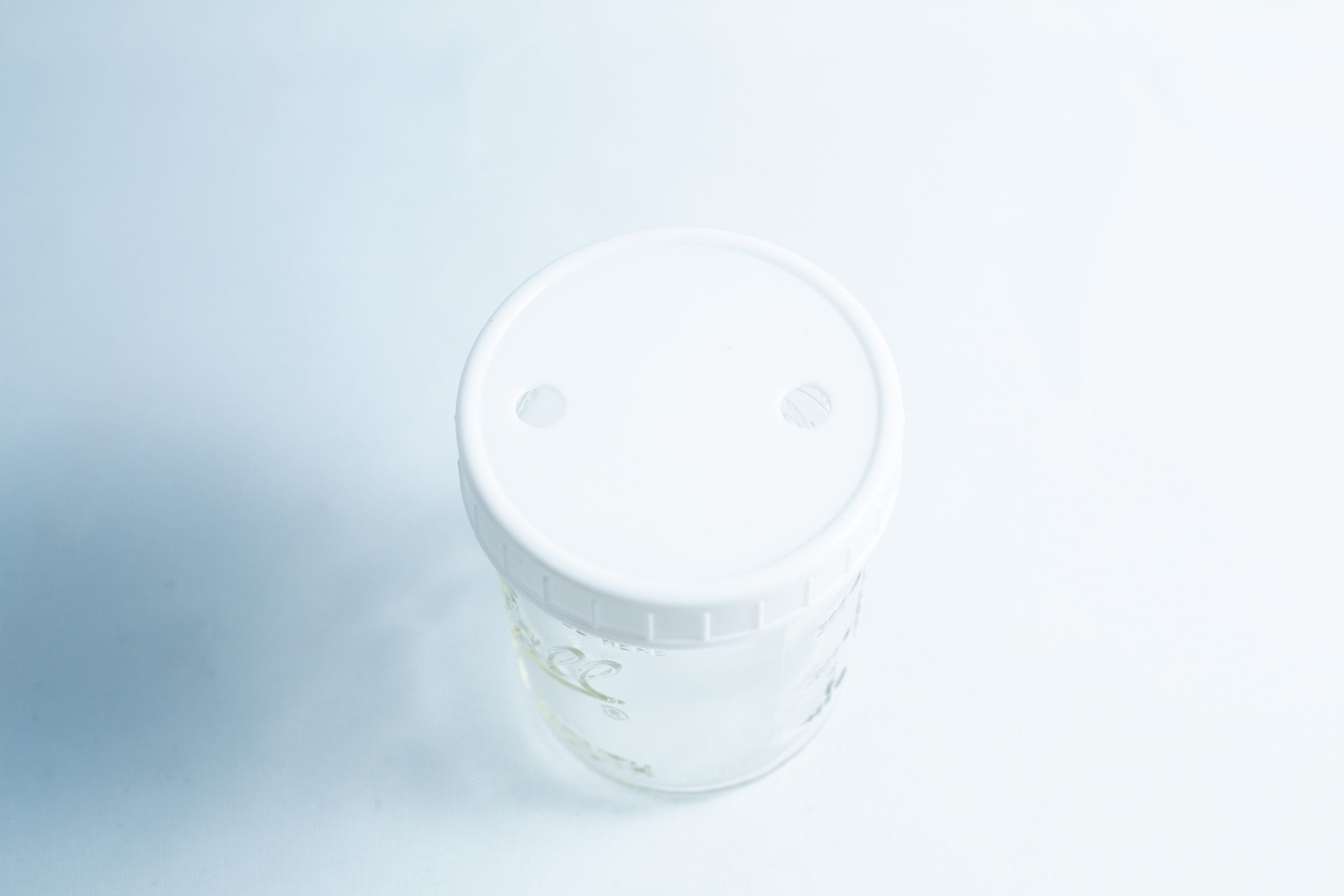 Clear plastic container with white lid, ideal for organising your Drill Bit for holes size 3mm-12mm Titanium Coated—viewed from above on a light background.