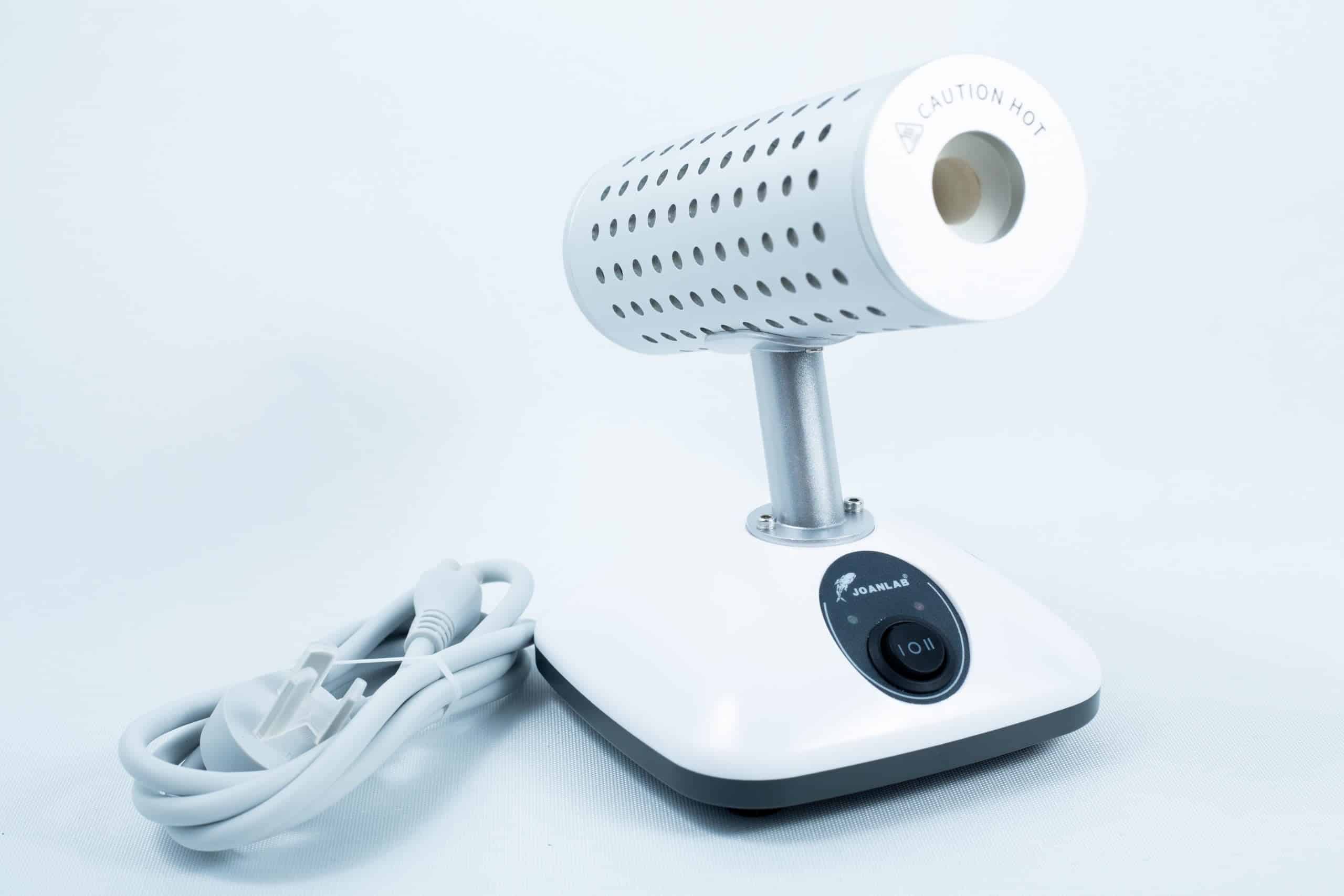 The Infrared Steriliser Bacti Cinerator Lab tool features a white base, power switch, and attached lead, providing efficient sterilisation for laboratory instruments.