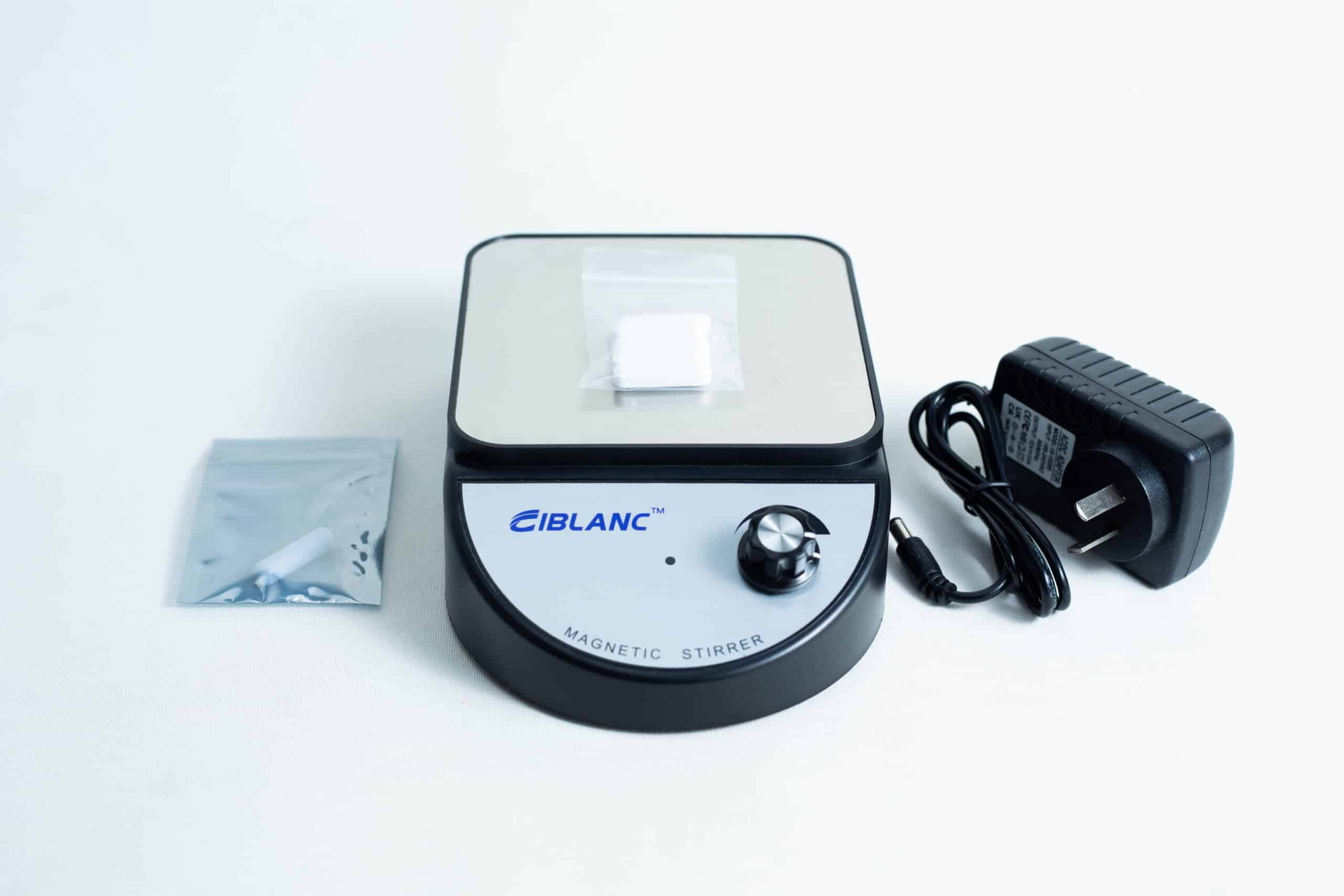 The Magnetic Stirrer Ciblanc 3500rpm is shown on a white background with a power adaptor and a small bag containing a magnetic stir bar.