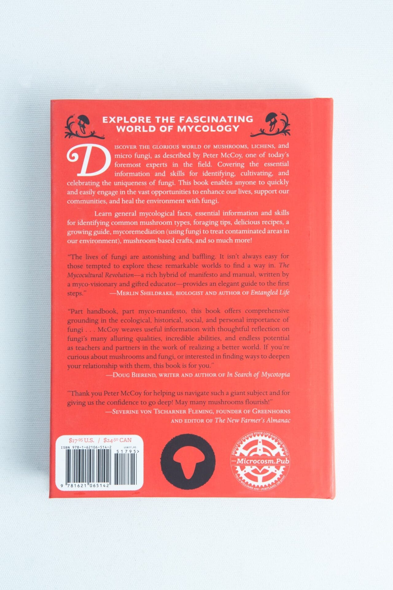 Back cover of "The Mycocultural Revolution" by Peter McCoy, in red, with summary, barcode, and publisher logos—ideal for mycology enthusiasts.