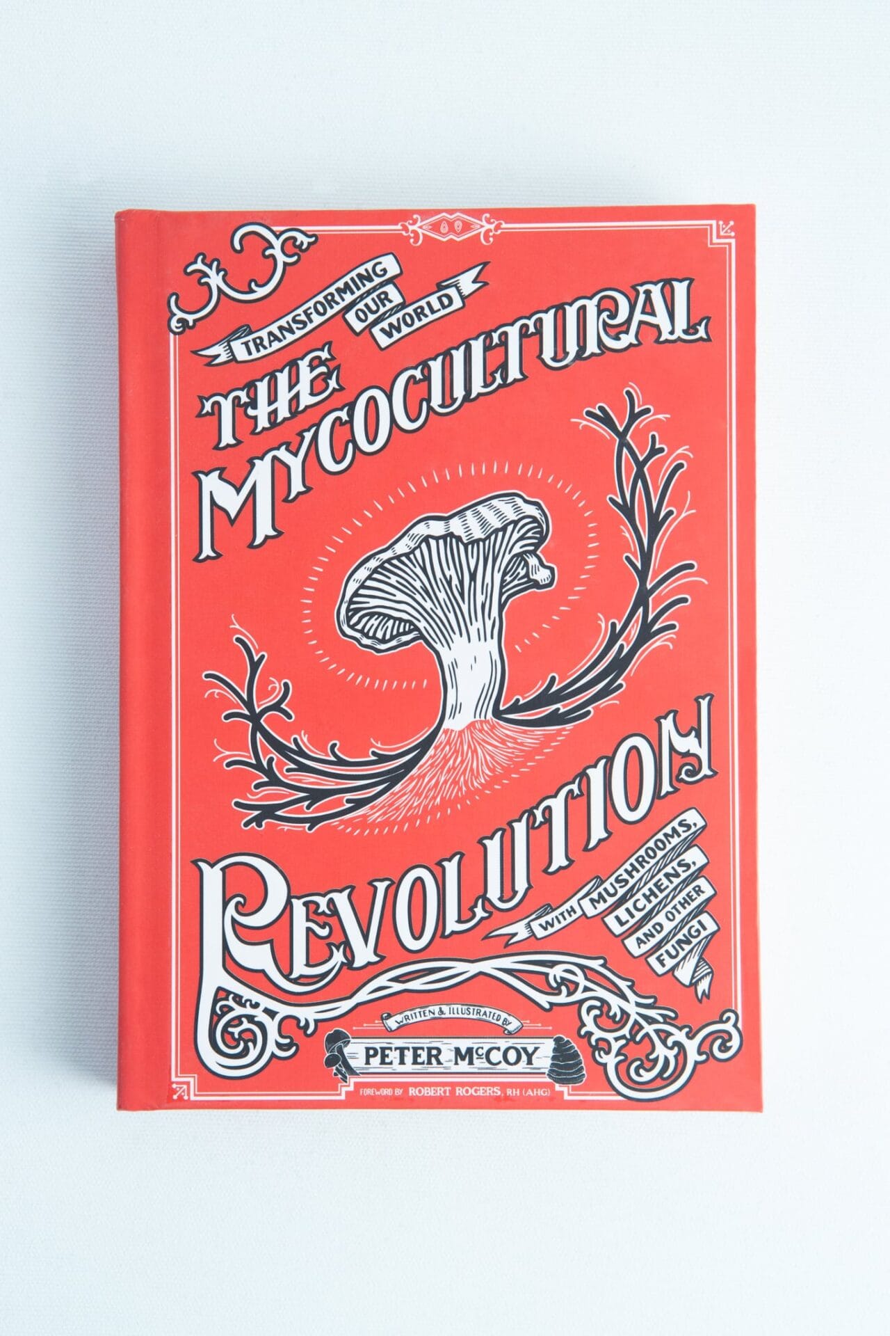 The Mycocultural Revolution: Book by Peter McCoy is a red mycology book featuring an illustrated mushroom on the cover.
