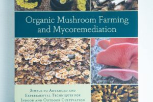 Book cover for "Organic Mushroom Farming and Mycoremediation: Book by Tradd Cotter," a top mycology book with mushroom photos and expert insights on mycoremediation.