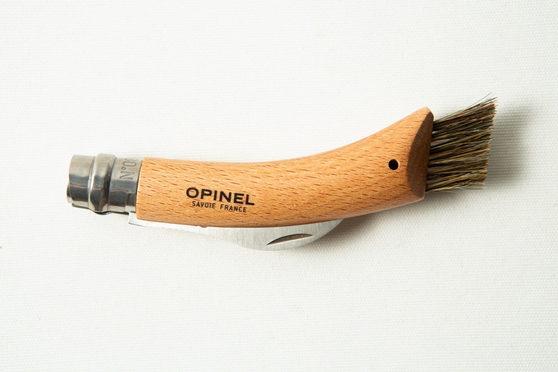 Opinel No 8 Folding Mushroom Knife with a beech handle and stainless steel blade, shown on a white background.