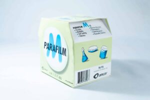 A box of Parafilm Lab sealing film, shown with beakers sealed for secure and flexible laboratory use.