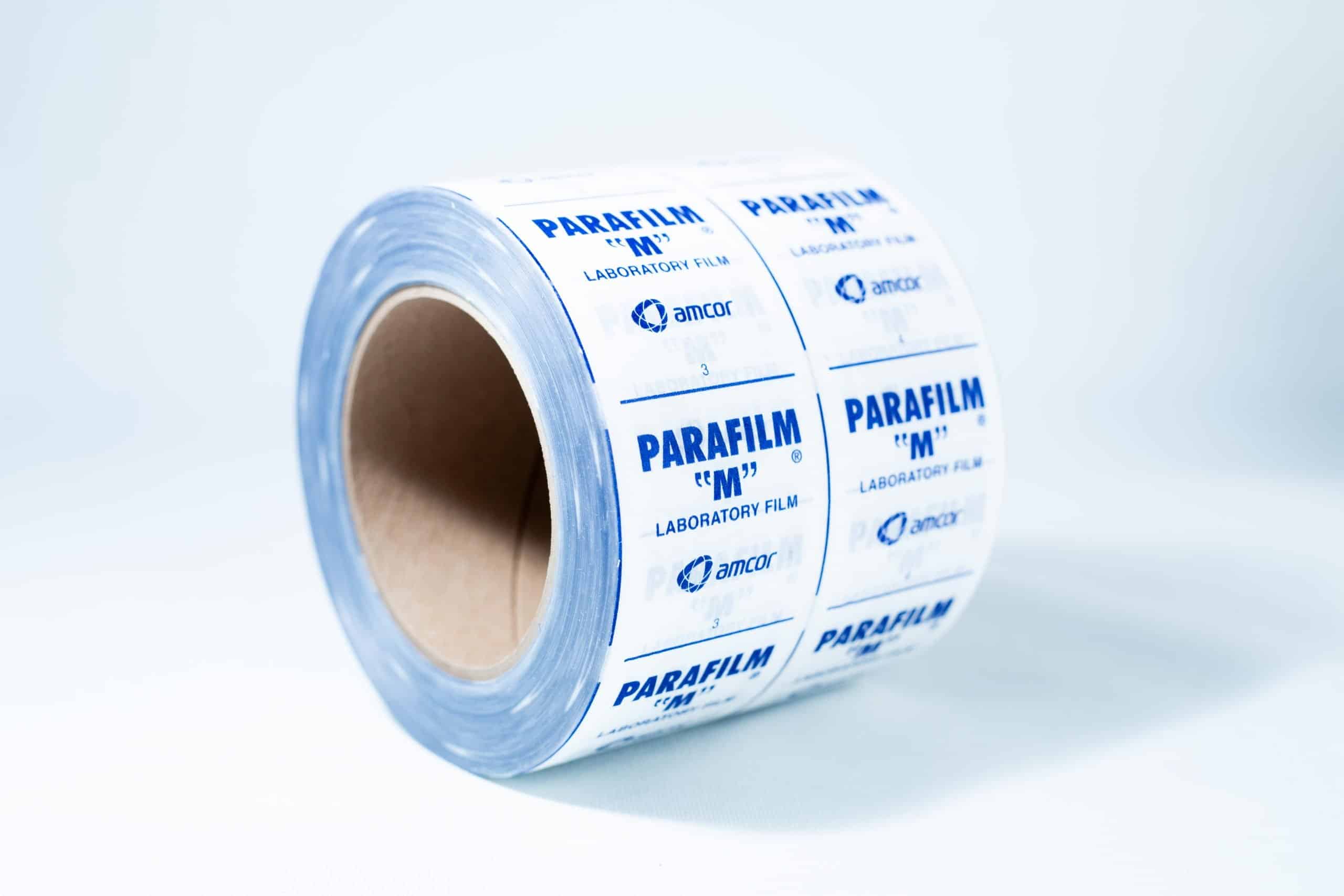 A roll of Parafilm Lab sealing film with blue text on a white background is placed on a white surface.