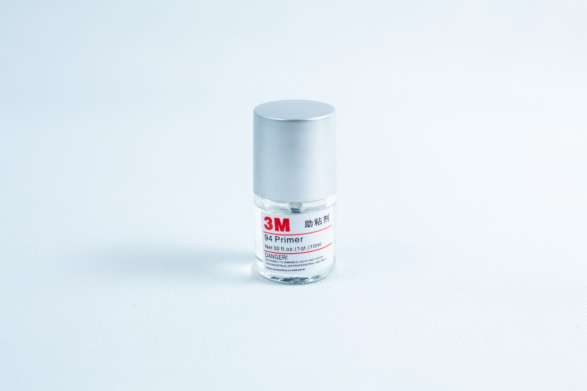 Primer 94 multisurface for 3M glue, 10ML bottle with silver cap on a white background—perfect as a tape primer for 3M adhesive applications.