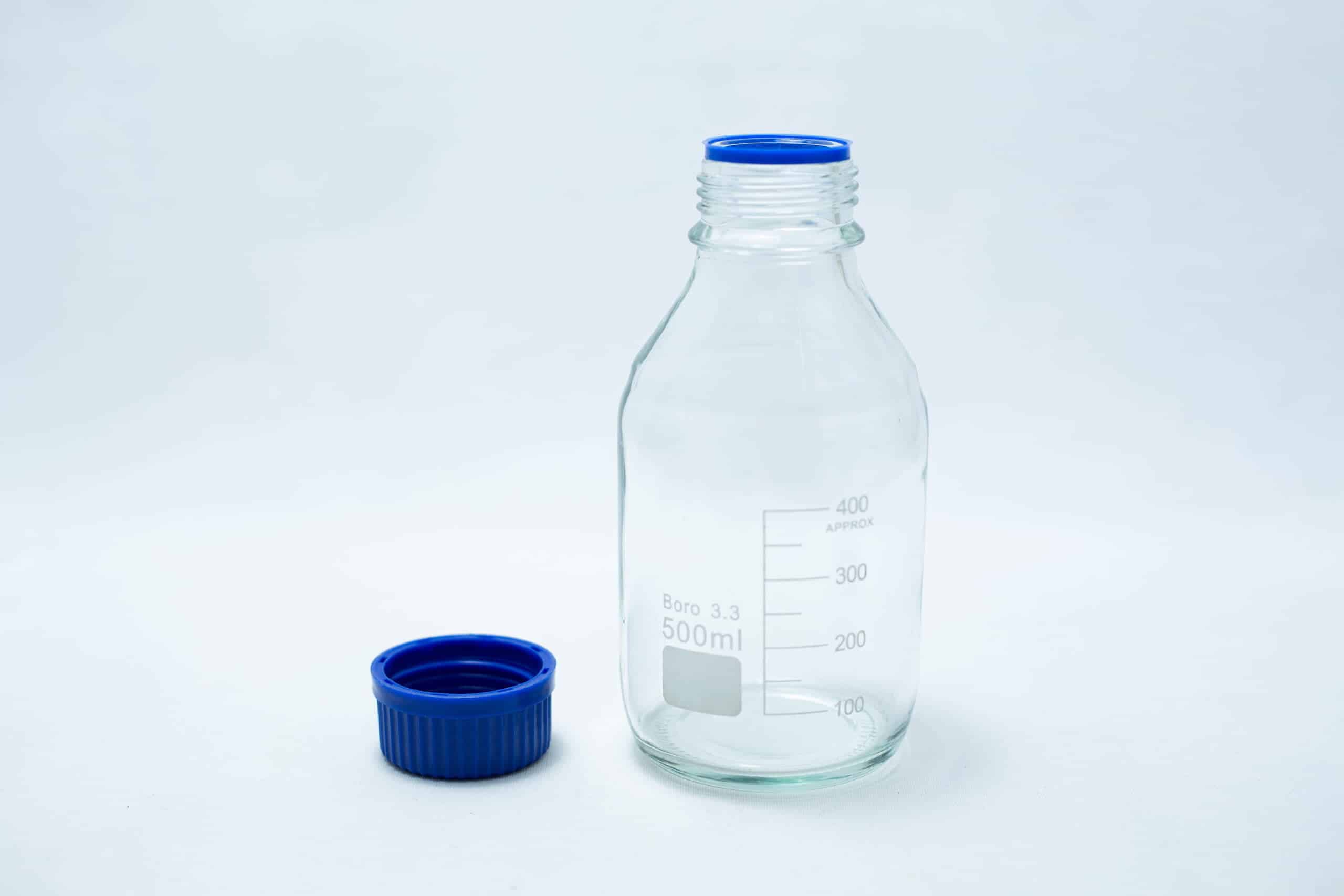 Reagent bottle 500ml with clear glass and blue cap, shown on a white background.