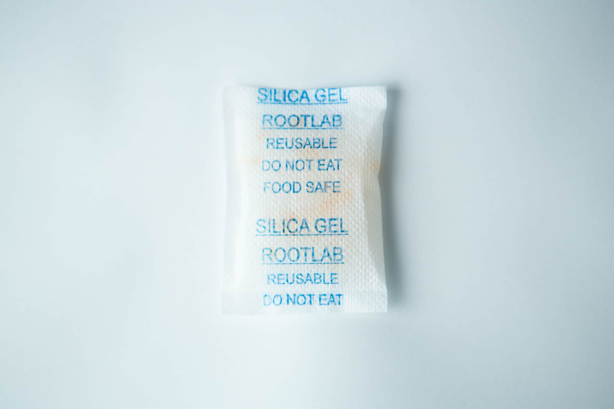 A white Desiccant Silica Gel 5g | Reusable packet labelled DO NOT EAT and FOOD SAFE on a plain white background.