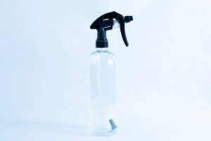 The Spray bottle Chemical resistant 1 Litre Heavy Duty, featuring a black nozzle, stands against a light blue background.