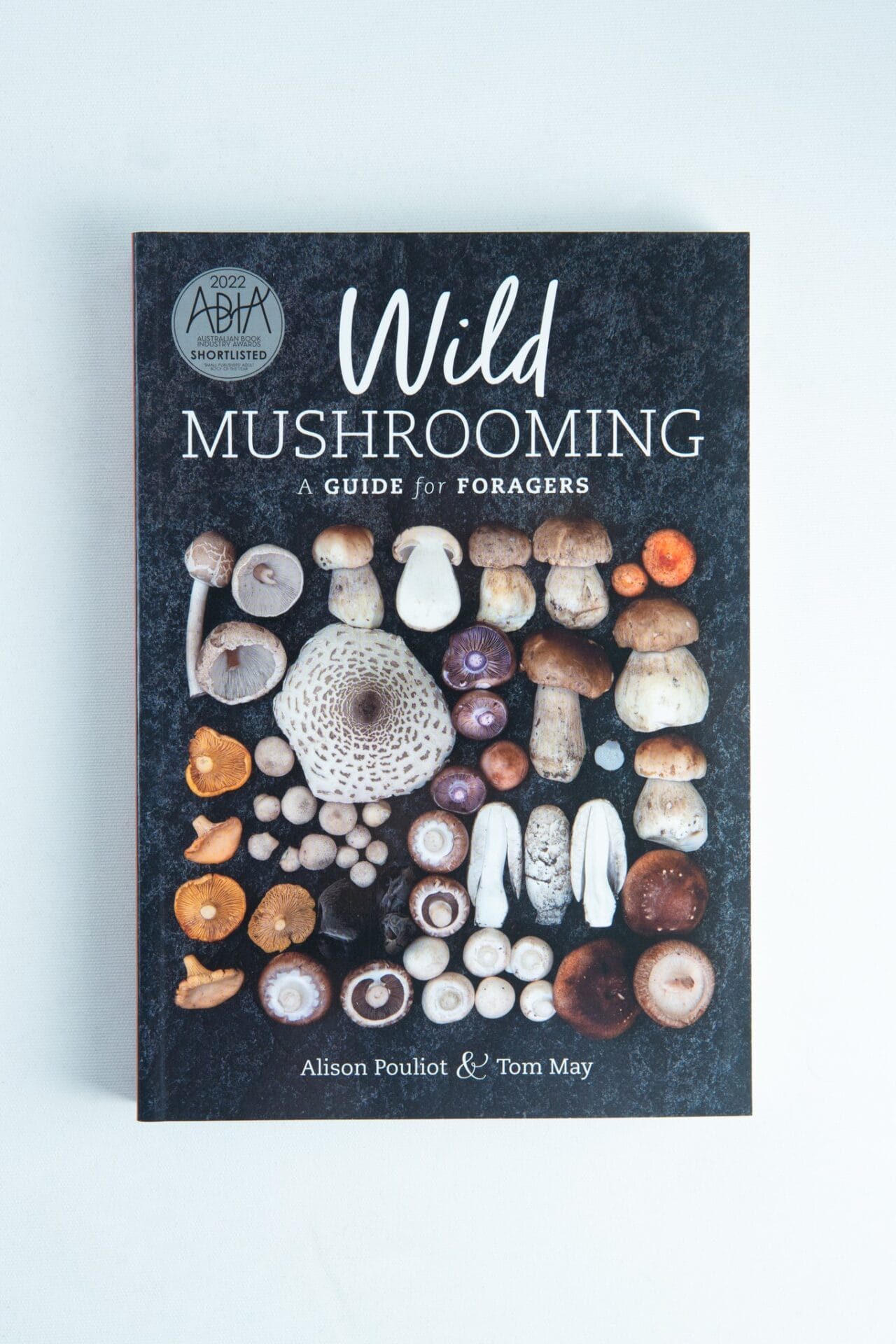 Explore Wild Mushrooming: A Guide for Foragers Book by Alison Pouliot and Tom May—ideal for nature lovers eager to start their foraging journey.
