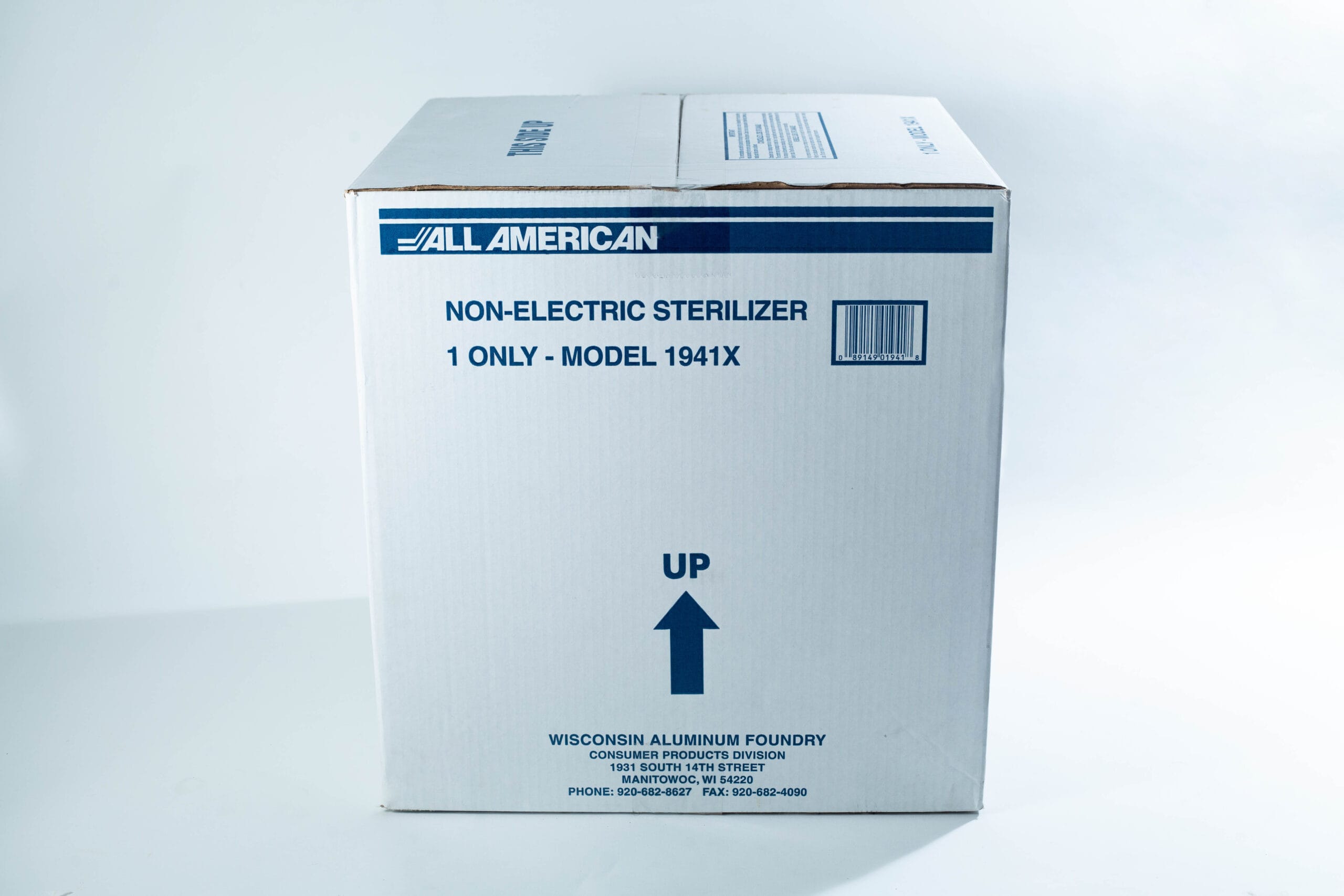 A large white box labelled Non-Electric Steriliser, Model 1941X with an arrow pointing up.