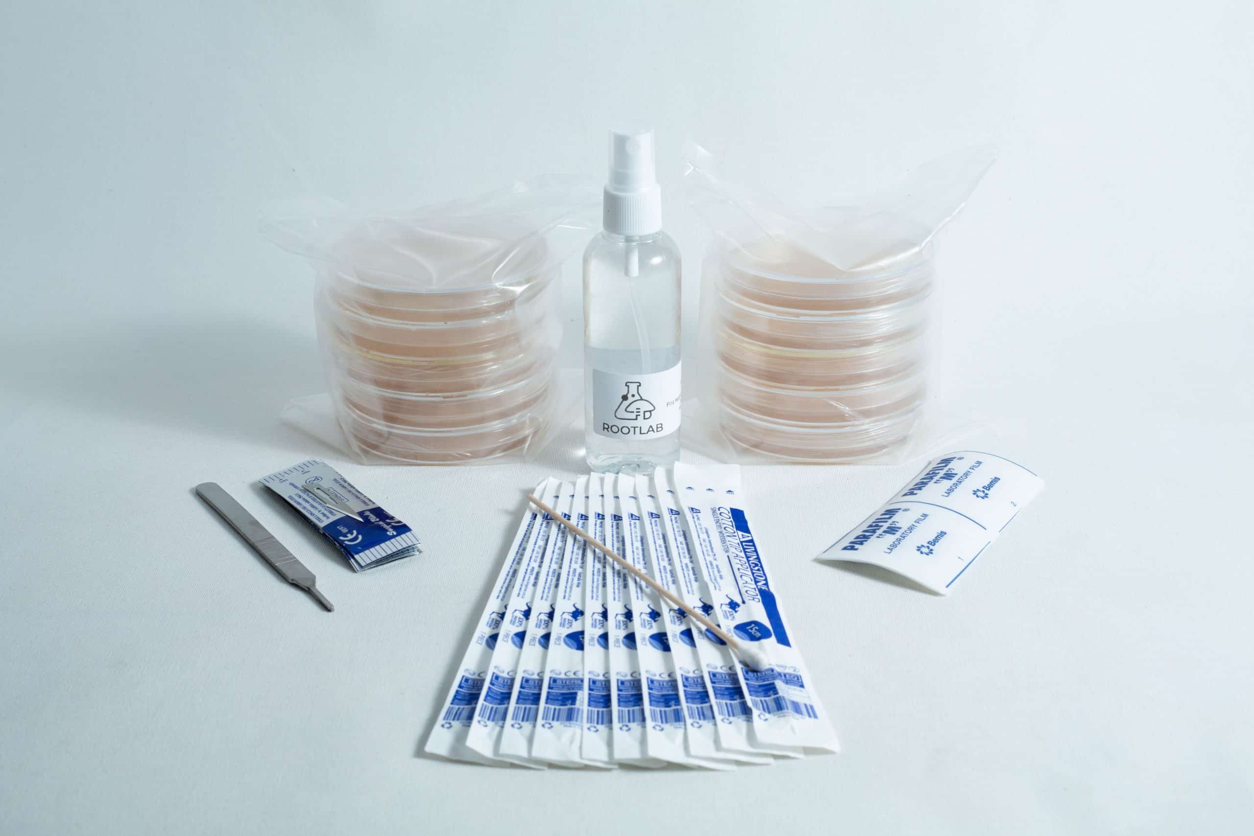 The Spore to Agar Transfer Kit includes sterile petri dishes, scalpel, swabs, spray bottle, and alcohol wipes, all displayed on a white background.