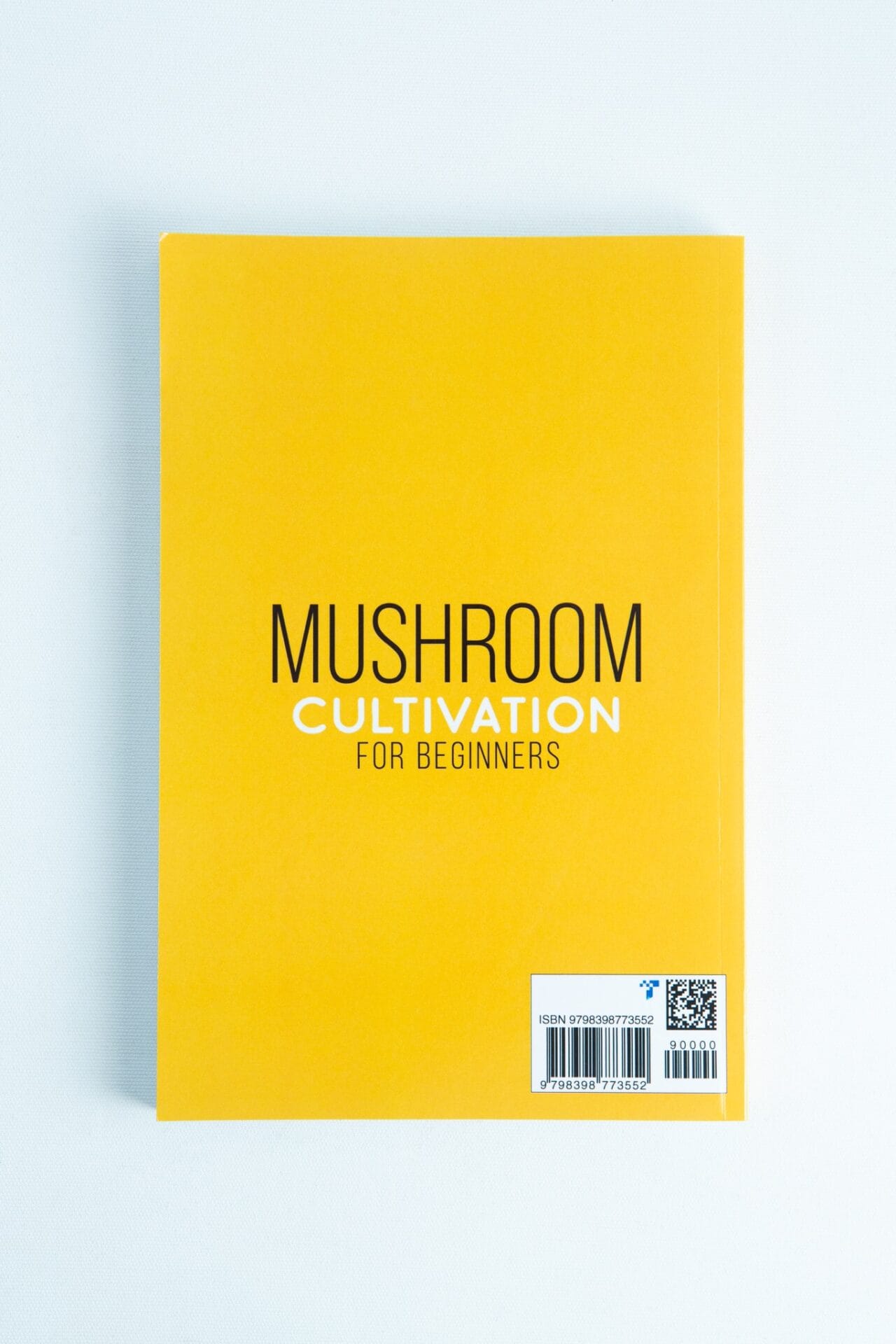Yellow book titled "Mushroom Cultivation for Beginners: The Complete Guide to Growing Your Own Gourmet and Medicinal Mushrooms at Home, Indoors and Outdoors" on a white background, ideal for new mushroom growers.