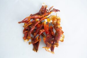 A cluster of orange and brown dried sea cucumbers rests on a white background, evoking the natural textures seen in a CO2 Generator Bag 3kg.