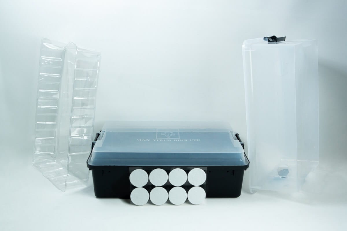 A plastic tub, two clear trays, eight round discs, and a tall clear container on a white background.
