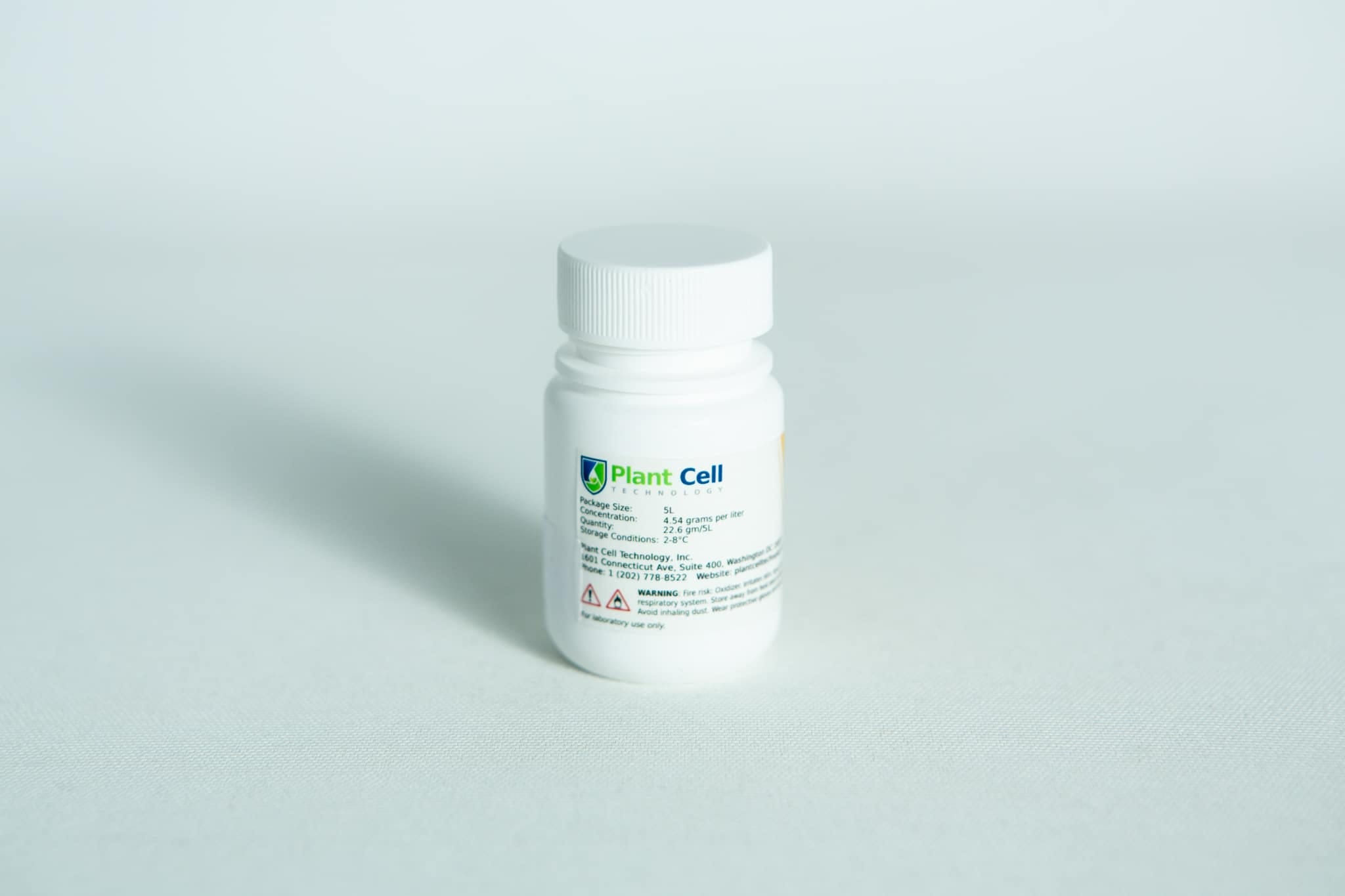 A white plastic bottle labelled “Plant Cell Tissue Culture Starter Kit” sits on a plain white surface.