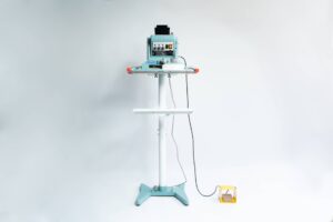 The Vertical Foot Heat Sealer VHVD 450mm Double 10mm by Venus is a standing industrial machine with a control panel and yellow foot pedal, shown against a white background.