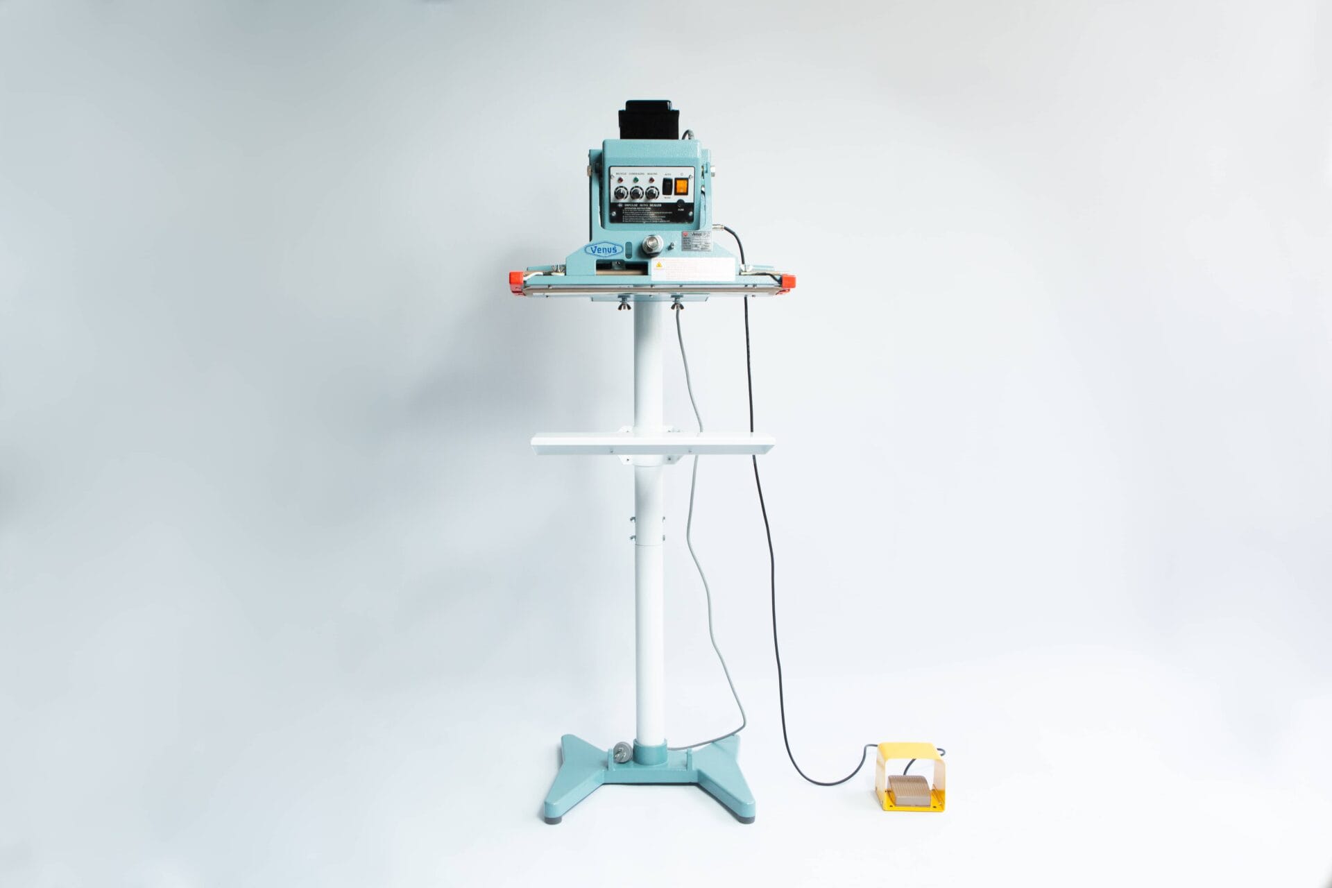 The Vertical Foot Heat Sealer VHVD 450mm Double 10mm by Venus is a standing industrial machine with a control panel and yellow foot pedal, shown against a white background.
