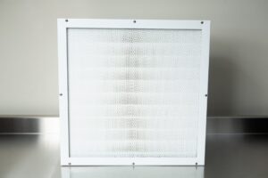 The Laminar Flow Hood HEPA Airfilter H14 with prefilter (60x60x35cm) and metal frame is shown on a reflective stainless steel surface.