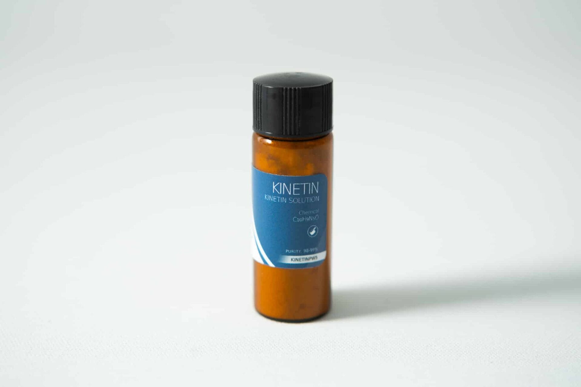 Brown bottle with black cap and blue label reading “Plant Cell Kinetin Powder” on a plain light background.