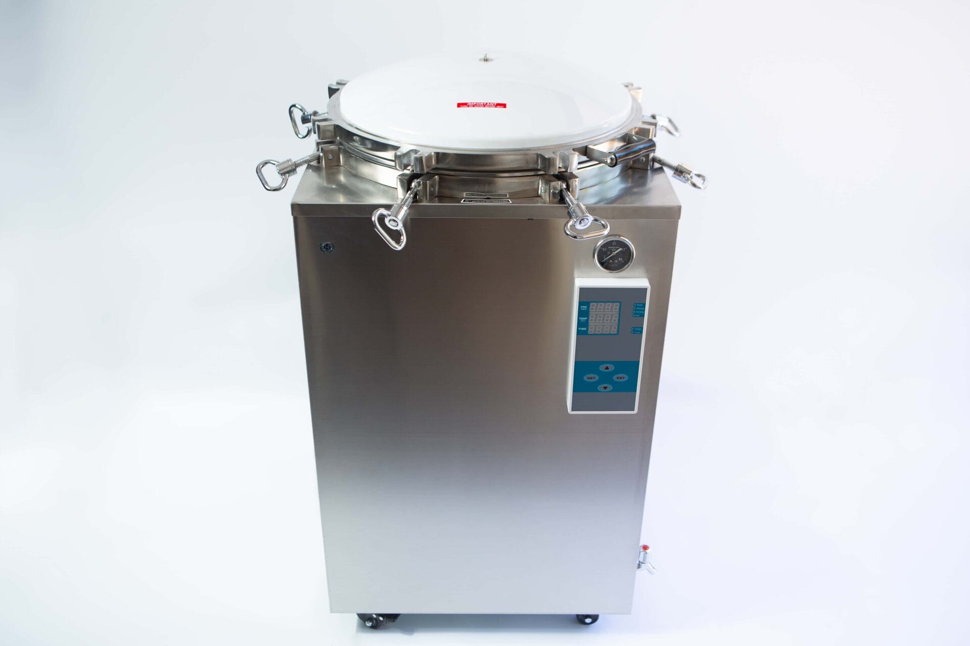 A stainless steel autoclave machine with a round lid and digital control panel on a white background.