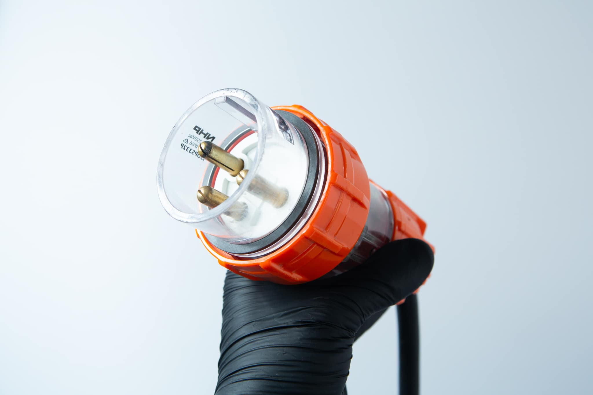 A hand in a black glove holds the Vertical Autoclave 150 Litres (Automatic) | Commercial use | 6KW against a light grey background.