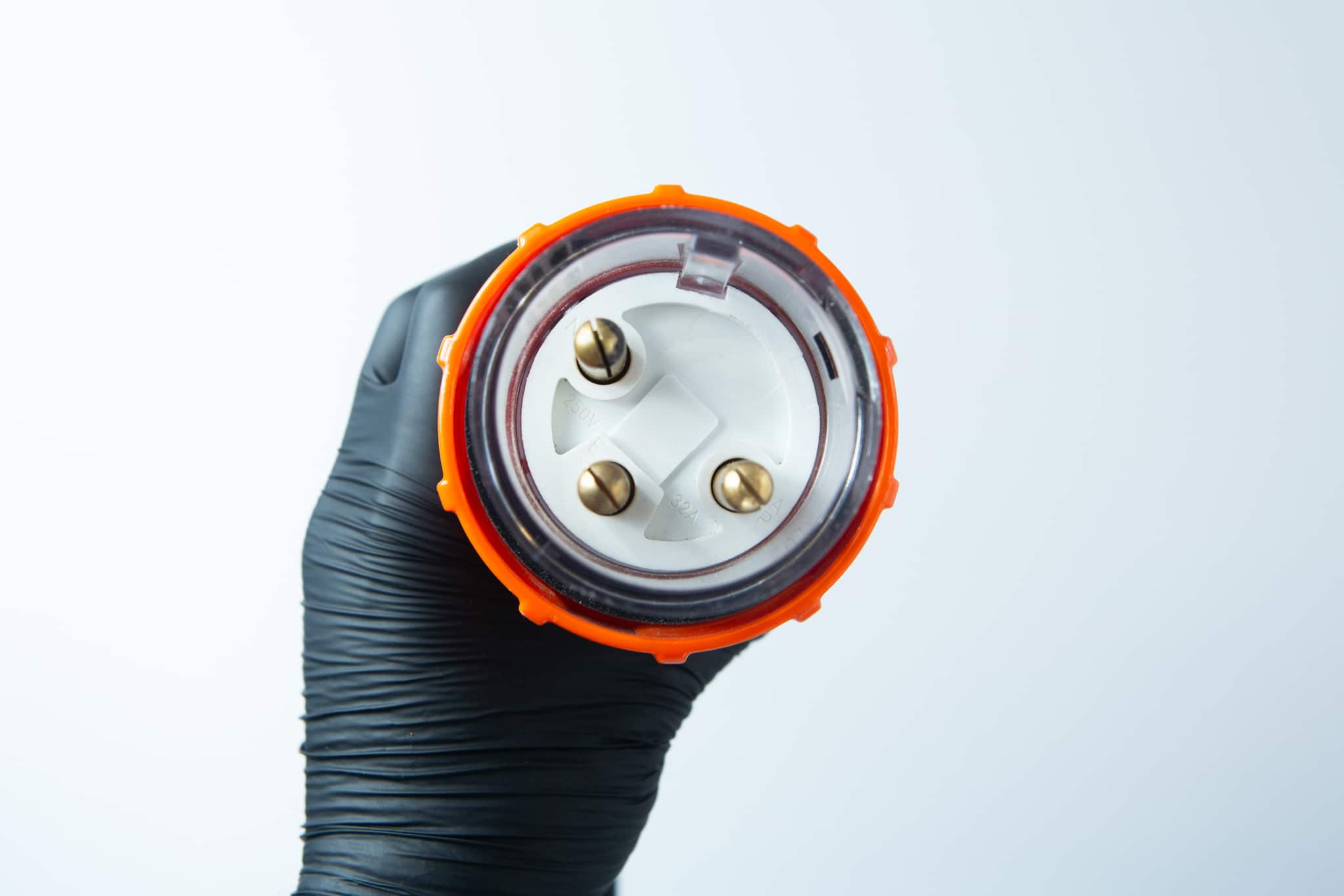 Gloved hand holding the Vertical Autoclave 150 Litres (Automatic) | Commercial use | 6kW, viewed from the front.