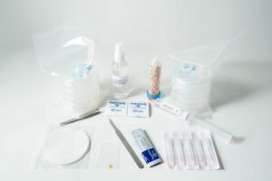 The Slime mould kit - Physarum polycephalum includes petri dishes, tweezers, syringes, Parafilm, spray bottle, scalpel, and more supplies arranged on a white surface.