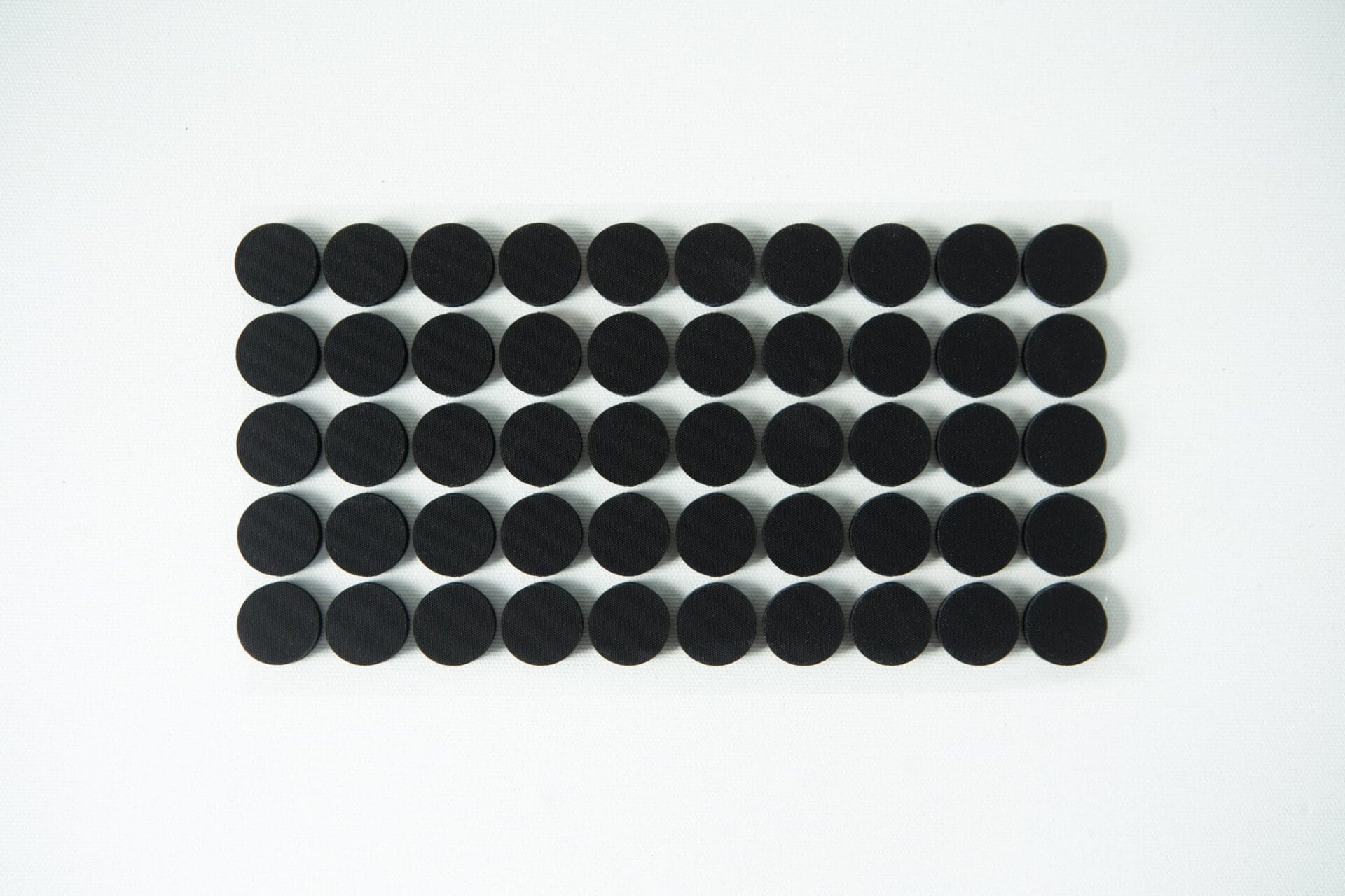 A grid of 40 black circular dots arranged in five rows on a white background.