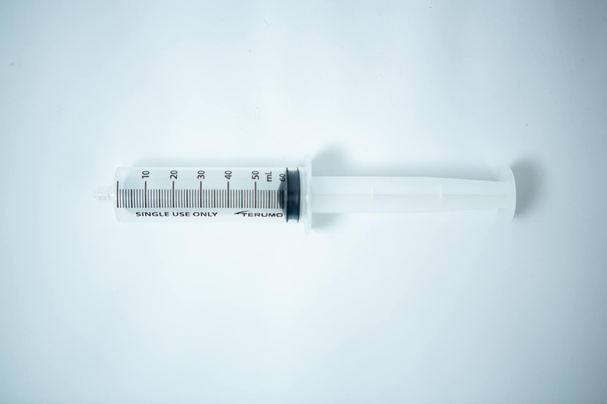 A large, empty plastic Syringes Luer lock with Hypodermic Needle and syringe Cap set labelled "single use only" on a white background—ideal for those seeking to buy syringes or browse syringes for sale online.