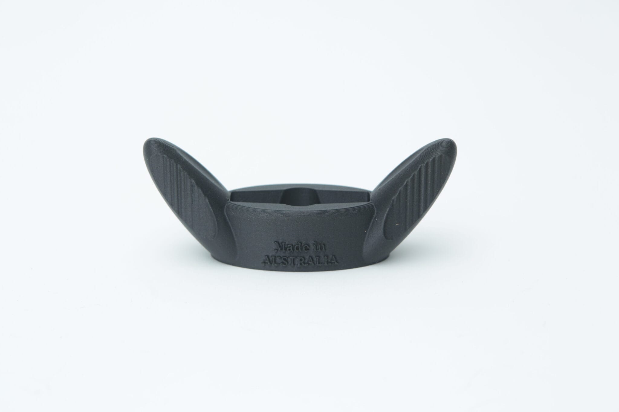 Black, winged plastic All-American Tool with "Made in AUSTRALIA" text, photographed on a plain white background.